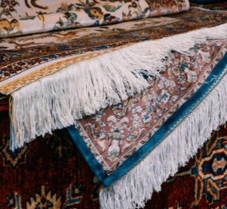 Handwoven Iranian Carpet with intricate patterns and vibrant colors, ideal for luxury home decor and international trade.