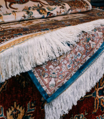 Handwoven Iranian Carpet with intricate patterns and vibrant colors, ideal for luxury home decor and international trade.